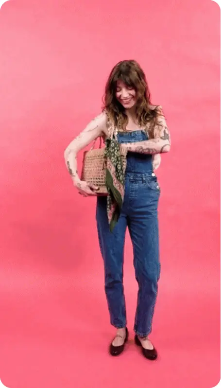A screenshot of a momox fashion social media video showing a woman in a momox fashion outfit